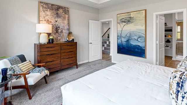 carpeted bedroom featuring baseboards