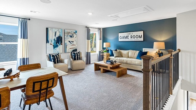 carpeted living room with visible vents