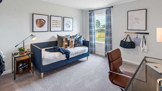 bedroom with carpet and baseboards