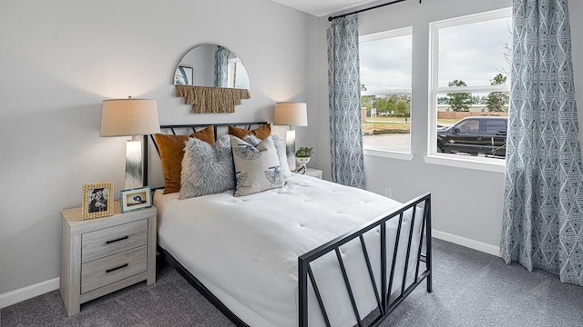 bedroom with carpet and baseboards