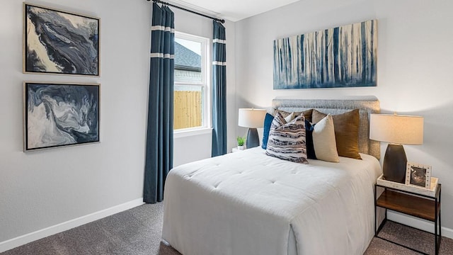 bedroom with carpet and baseboards