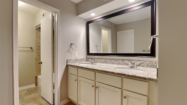 bathroom featuring shower / washtub combination and vanity