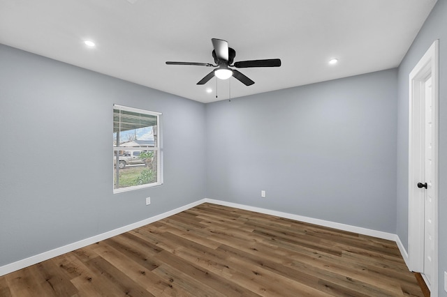 unfurnished room with ceiling fan and wood-type flooring