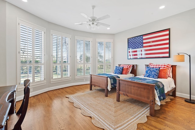 bedroom featuring ceiling fan and hardwood / wood-style floors