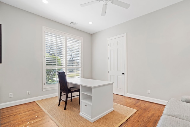 office area featuring ceiling fan, light hardwood / wood-style floors, and a healthy amount of sunlight