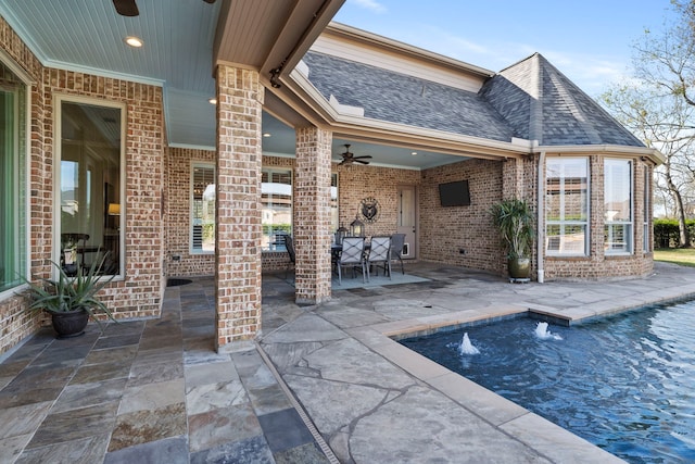 view of pool featuring ceiling fan and a patio