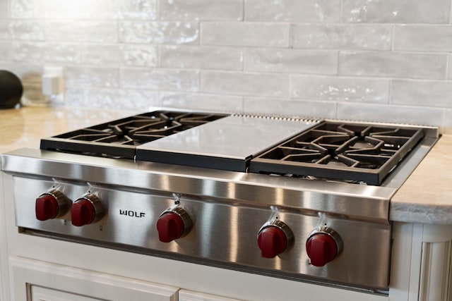 details with decorative backsplash and stove