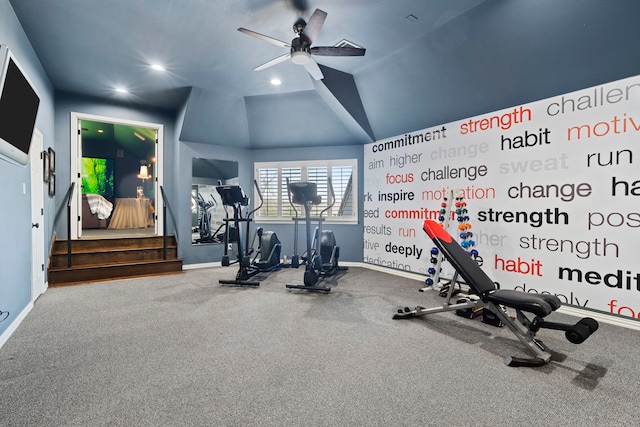 workout room with ceiling fan and vaulted ceiling