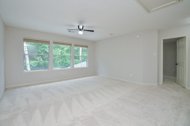 carpeted spare room with ceiling fan and a healthy amount of sunlight