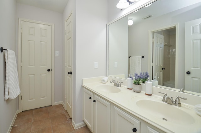 bathroom with vanity and tile patterned flooring