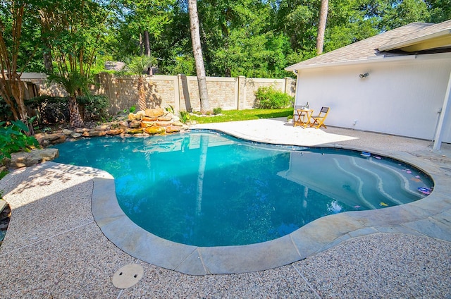 view of swimming pool featuring a patio area