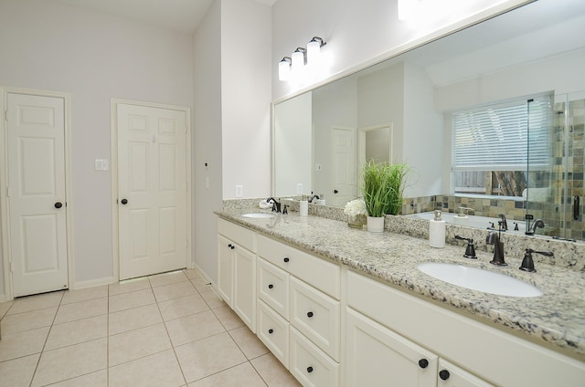 bathroom with tile patterned floors and vanity