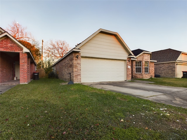 exterior space with a garage and a yard