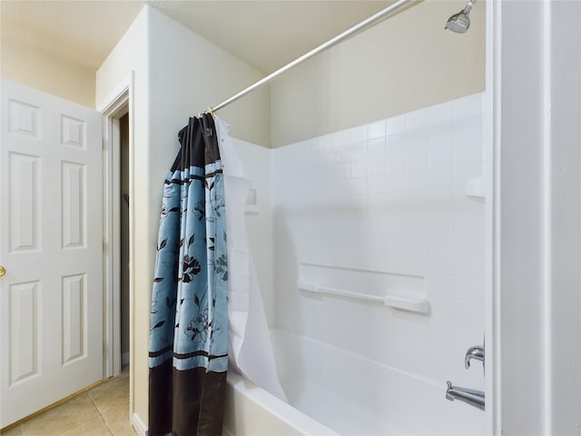 bathroom featuring tile patterned floors and shower / bathtub combination with curtain