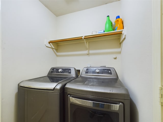 washroom with washing machine and dryer