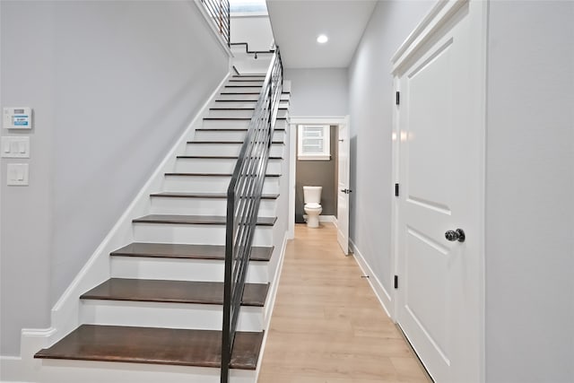 staircase featuring hardwood / wood-style flooring