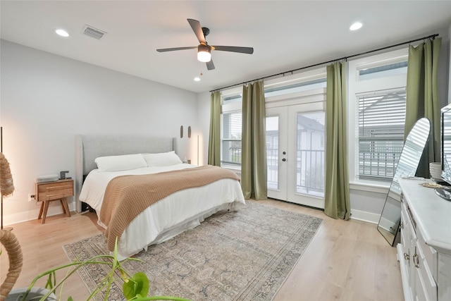 bedroom featuring ceiling fan, access to exterior, light hardwood / wood-style floors, and french doors