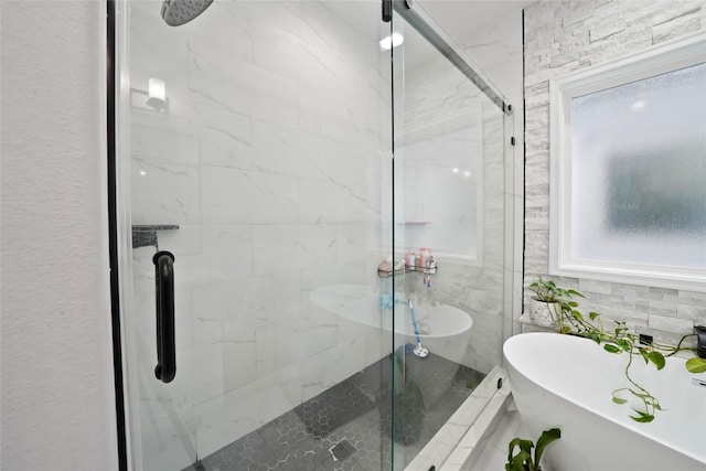 bathroom featuring plus walk in shower and tasteful backsplash