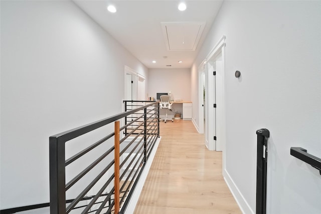 corridor with light hardwood / wood-style flooring