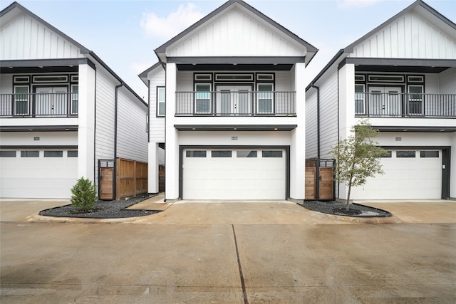 view of front of home with a garage and a balcony