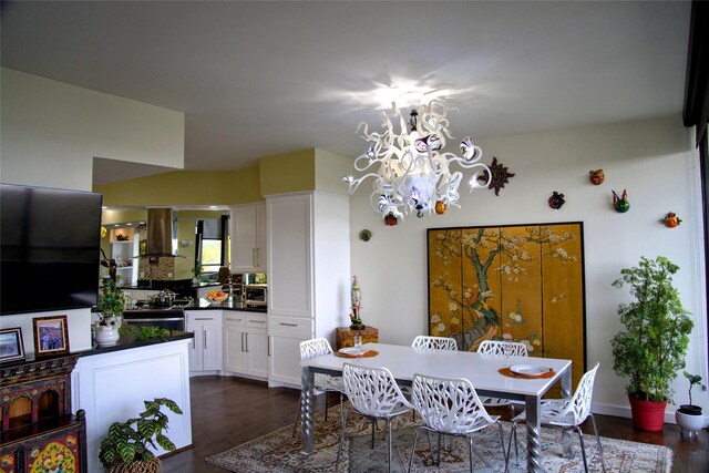 dining space with dark hardwood / wood-style flooring and an inviting chandelier