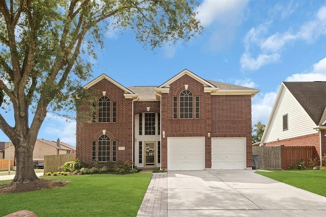 view of front property with a front yard and a garage