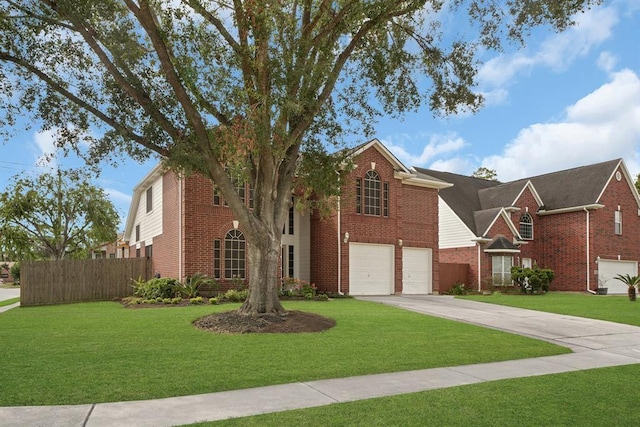 view of front of home featuring a front yard and a garage