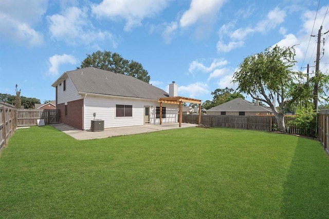 rear view of property with central air condition unit, a patio area, a yard, and a pergola