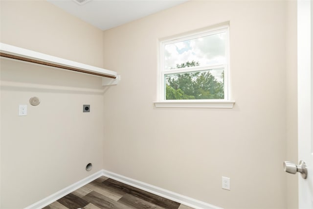 washroom with dark hardwood / wood-style flooring and electric dryer hookup