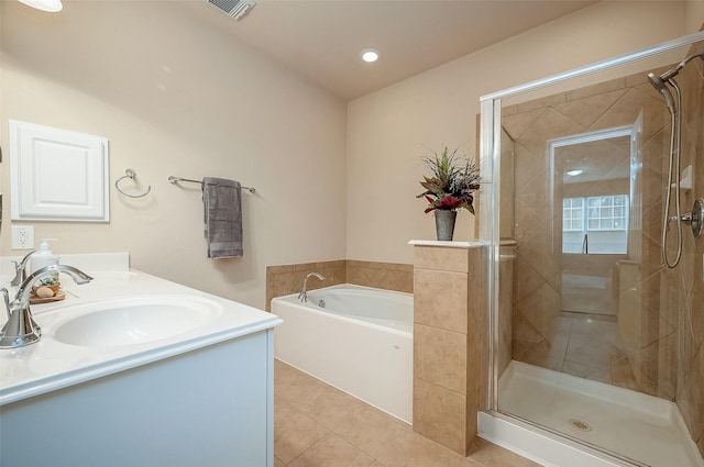 bathroom featuring vanity, tile patterned floors, and plus walk in shower