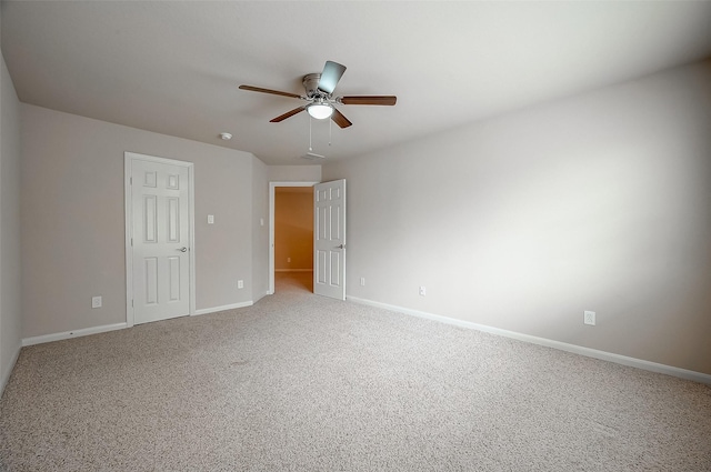 unfurnished room with carpet and ceiling fan