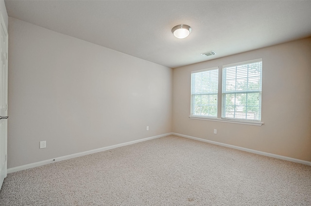 spare room featuring carpet floors