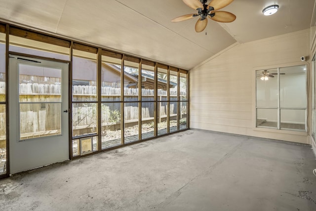 unfurnished sunroom with ceiling fan