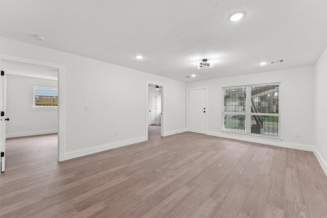 spare room featuring light wood-type flooring