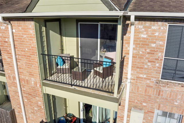 view of side of home with a balcony