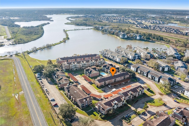 birds eye view of property featuring a water view