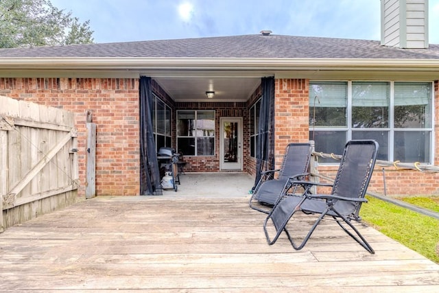 wooden deck featuring area for grilling