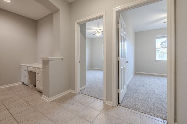 corridor with light colored carpet