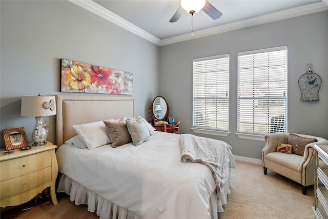 carpeted bedroom with ceiling fan and crown molding