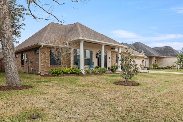 view of front of home with a front yard and a garage