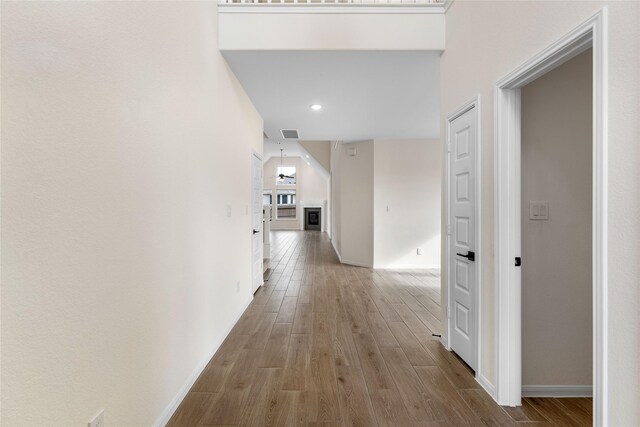 corridor featuring wood-type flooring