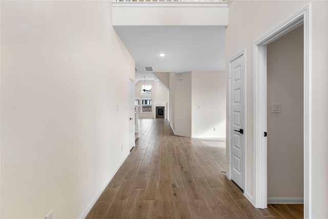 corridor featuring hardwood / wood-style floors