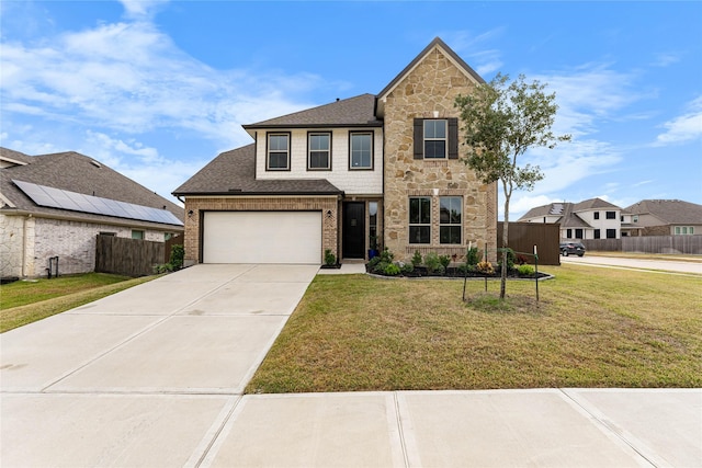 view of front property featuring a front lawn and a garage