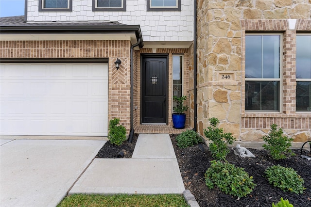 view of exterior entry featuring a garage