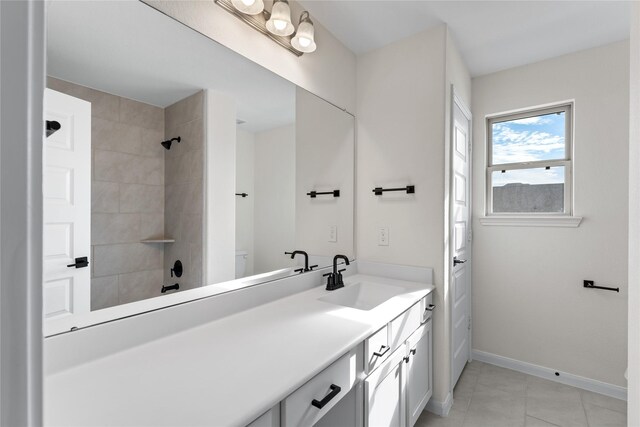 bathroom with tile patterned floors and vanity