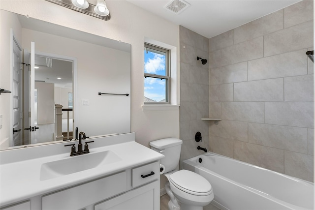 full bathroom with vanity, toilet, and tiled shower / bath combo