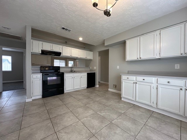 kitchen featuring white cabinetry, black / electric stove, and light tile patterned flooring