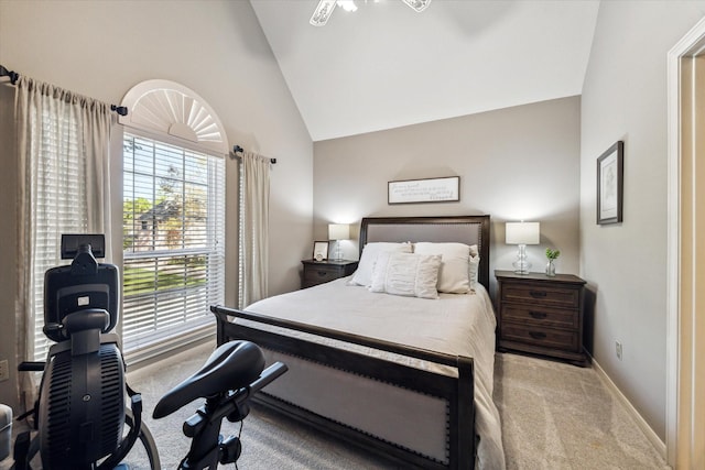 bedroom featuring light carpet and high vaulted ceiling