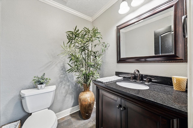 bathroom featuring a textured ceiling, toilet, vanity, and ornamental molding