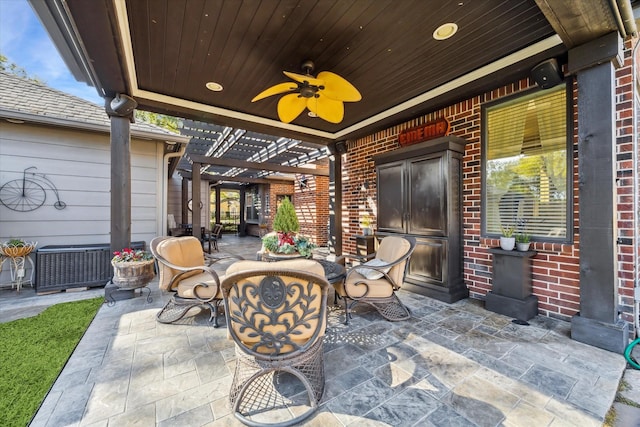 view of patio featuring ceiling fan